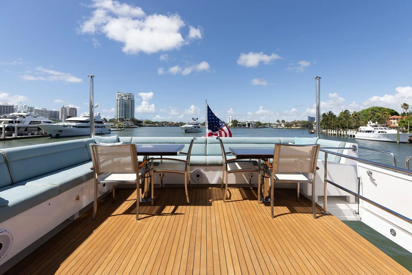 The aft deck offers a spacious and inviting area for relaxation with a beautiful view of the marina. aboard RITZ SEA Yacht for Sale