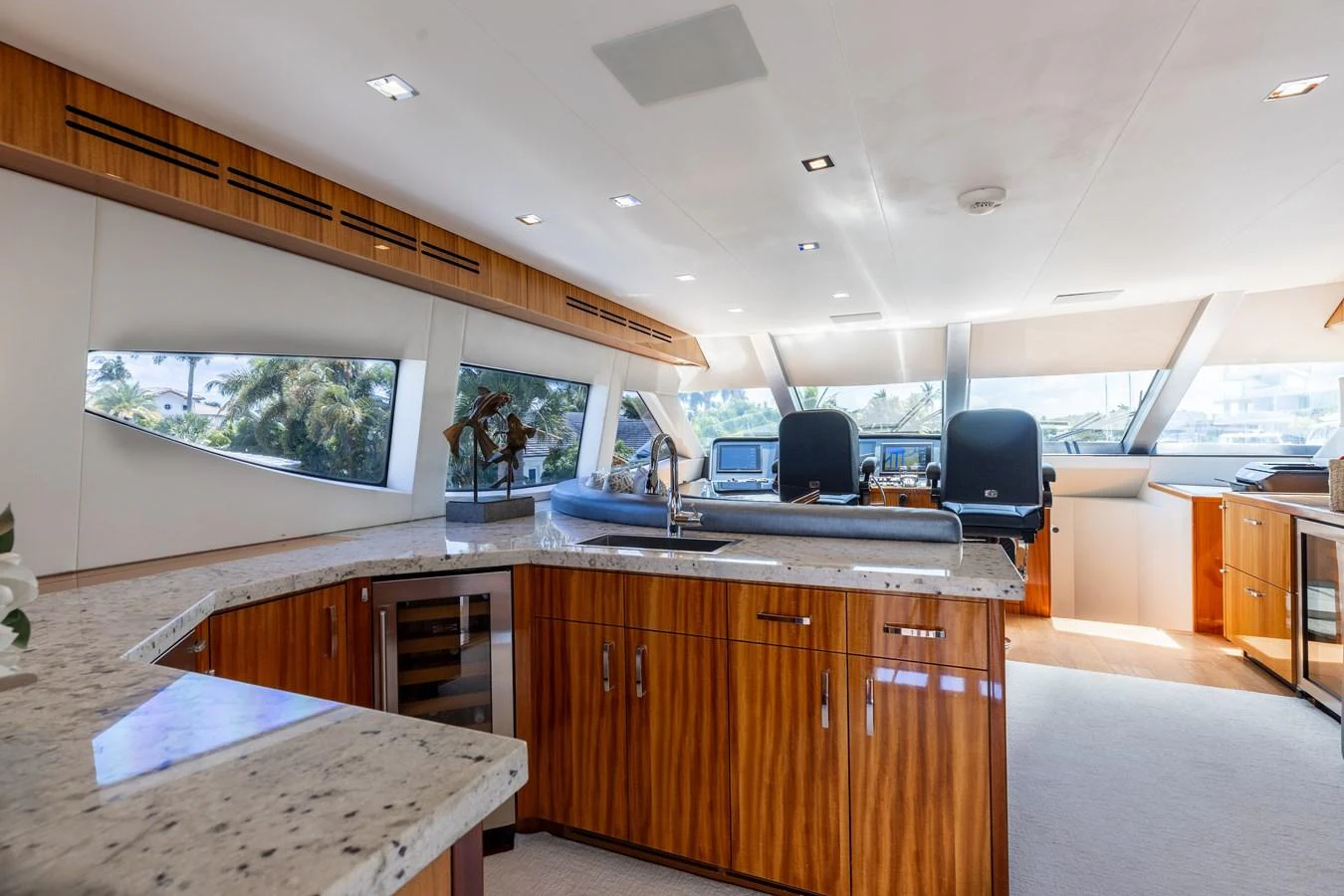 The yacht's galley features modern appliances and elegant wood finishes, creating a luxurious and functional space. aboard RITZ SEA Yacht for Sale