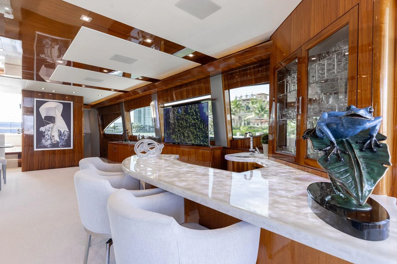 The salon features elegant decor with a marble countertop and plush seating, creating a luxurious and inviting atmosphere. aboard RITZ SEA Yacht for Sale