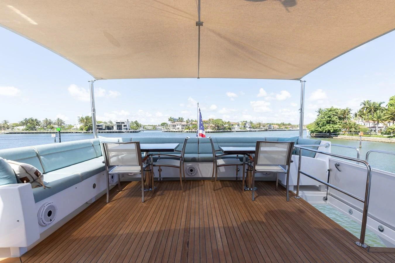 The aft deck offers a spacious and shaded area with comfortable seating and stunning water views. aboard RITZ SEA Yacht for Sale