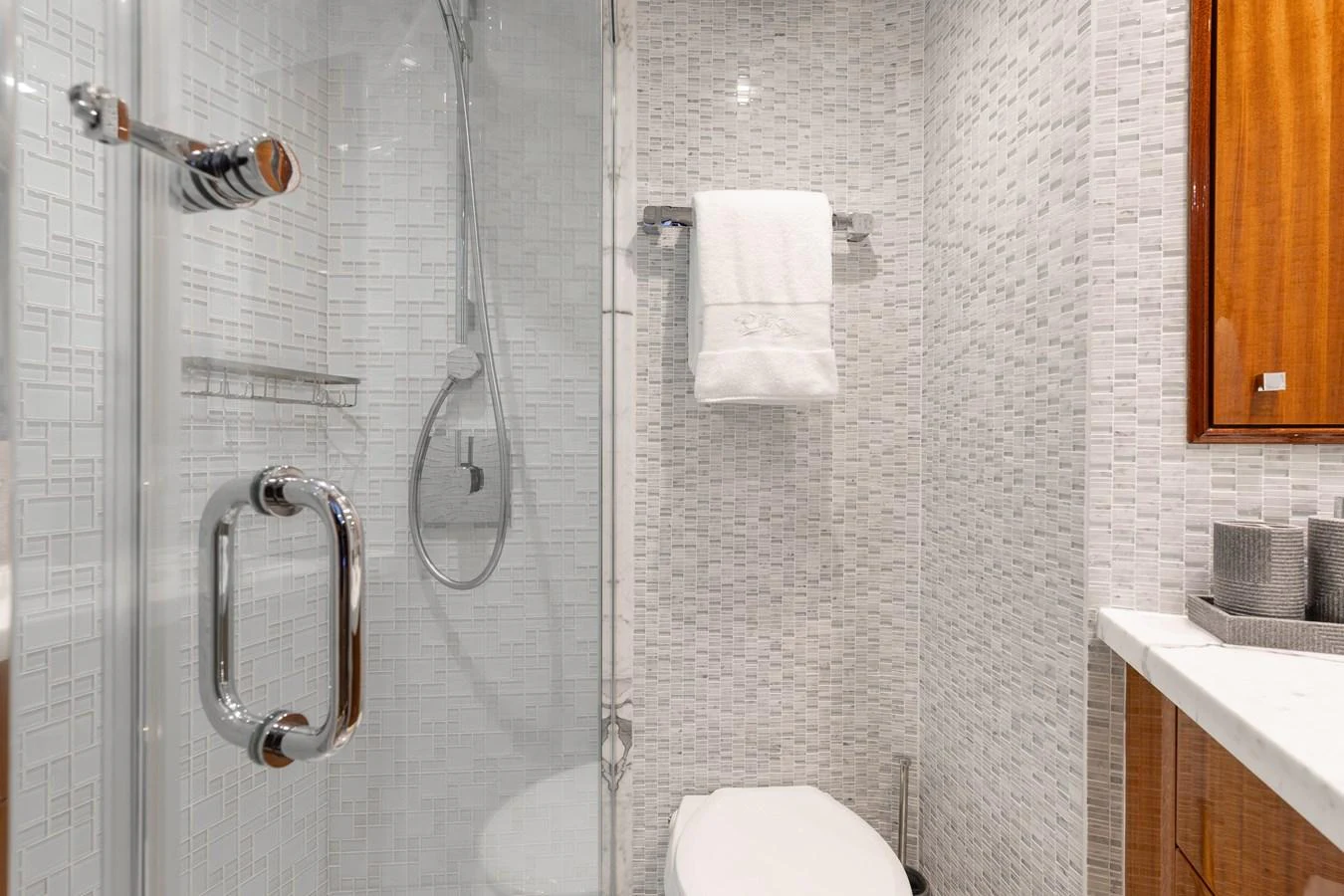 The yacht's bathroom features a sleek design with a glass-enclosed shower and modern fixtures. aboard RITZ SEA Yacht for Sale