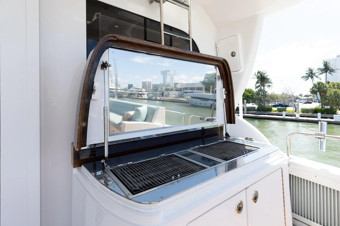 This image showcases a sleek built-in grill on the yacht's deck, perfect for outdoor dining with a view. aboard RITZ SEA Yacht for Sale
