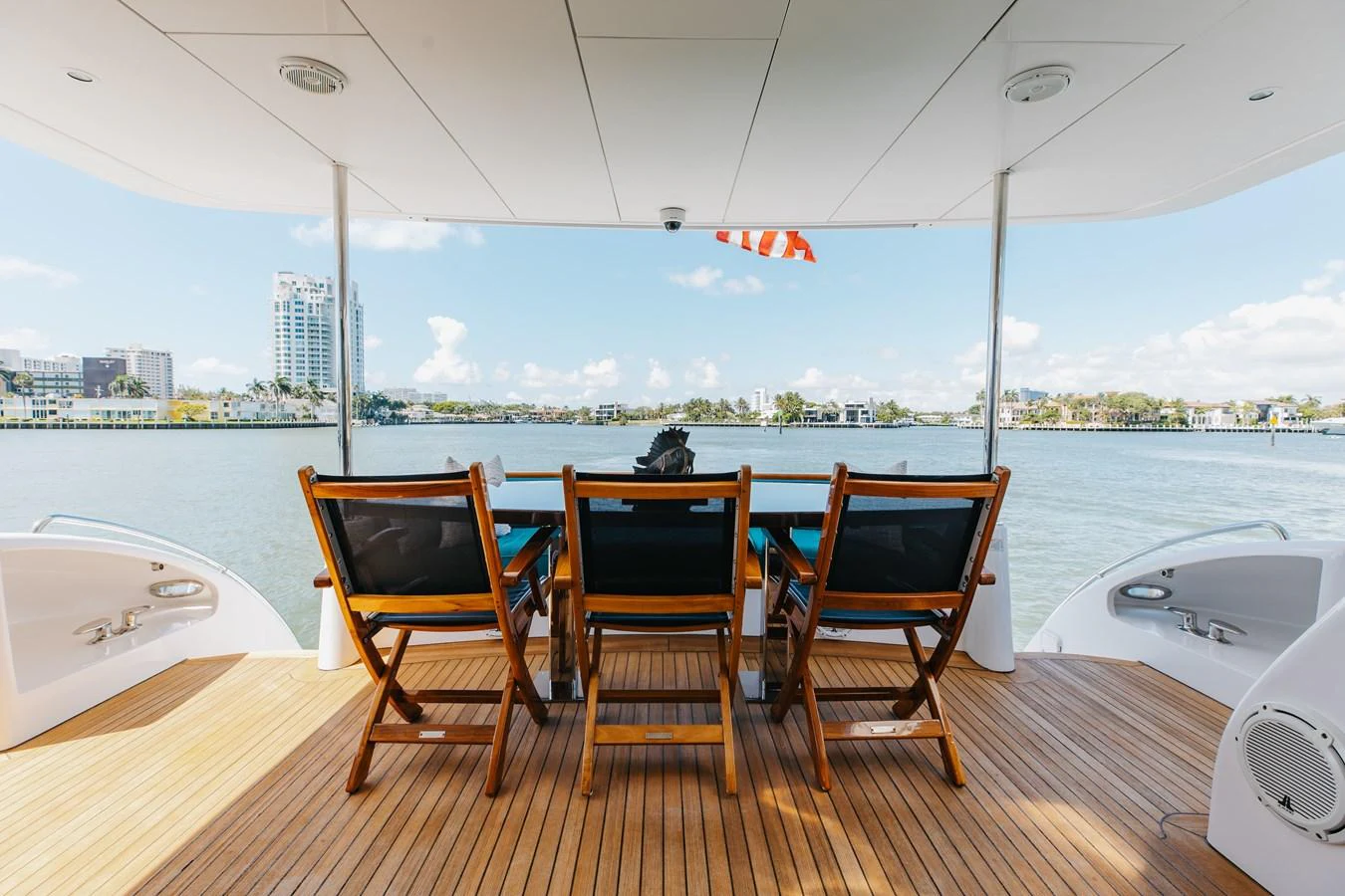 The aft deck offers a serene dining area with a stunning view of the water. aboard RITZ SEA Yacht for Sale