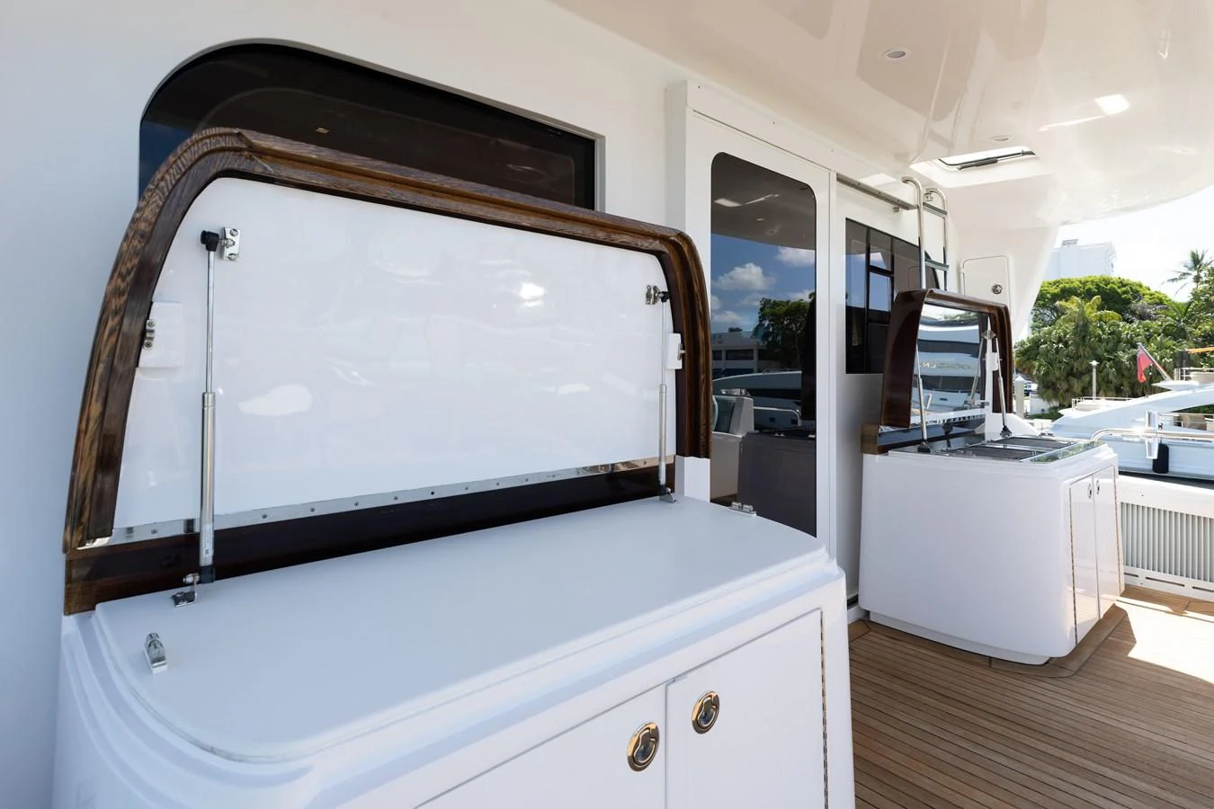 The yacht's deck features a sleek outdoor bar area with modern amenities. aboard RITZ SEA Yacht for Sale
