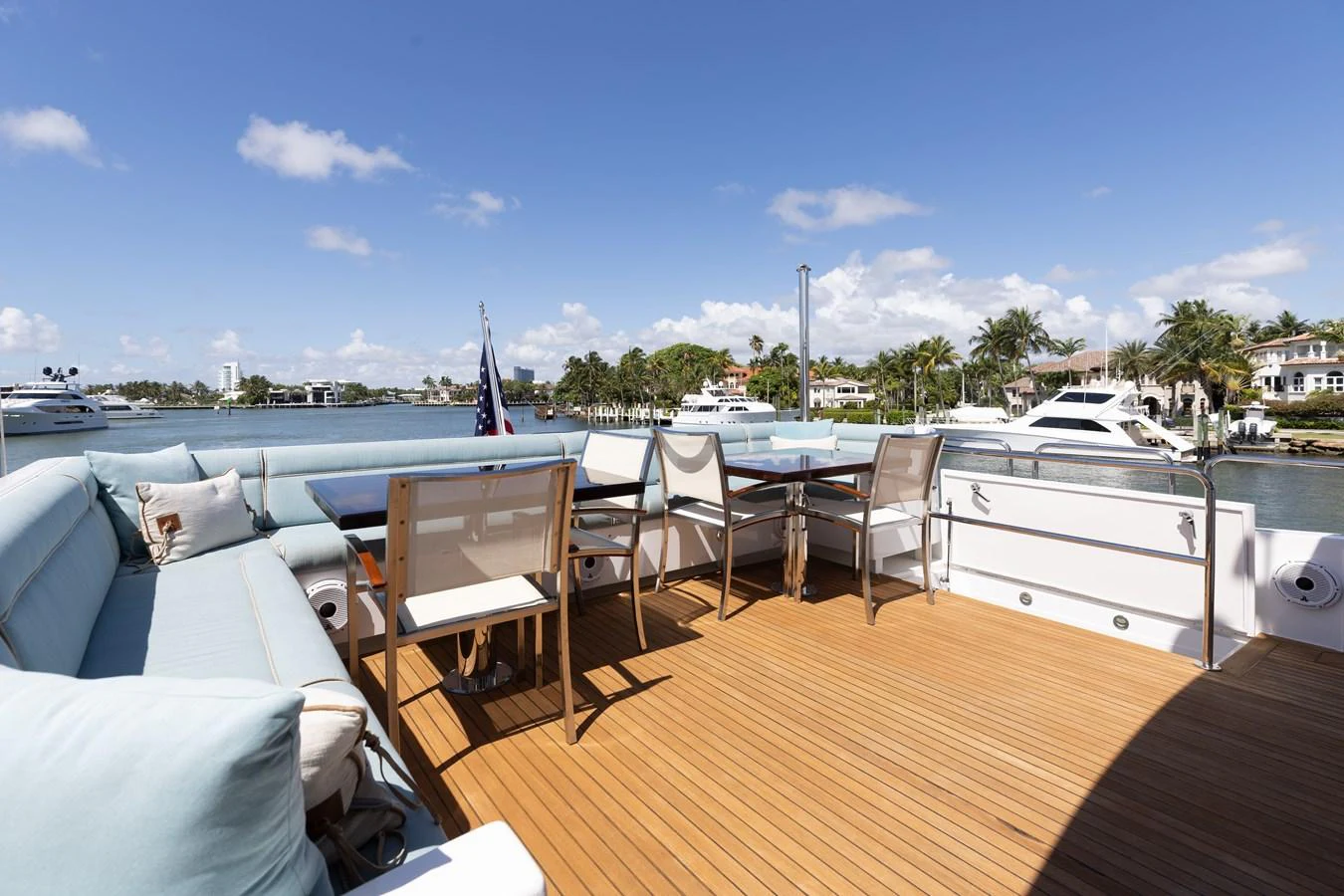 The aft deck offers a spacious and inviting area for relaxation and dining with stunning waterfront views. aboard RITZ SEA Yacht for Sale