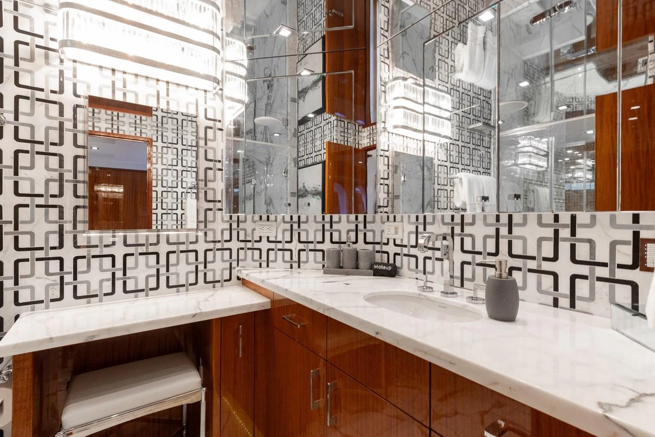 The bathroom features modern fixtures and a stylish geometric design. aboard RITZ SEA Yacht for Sale