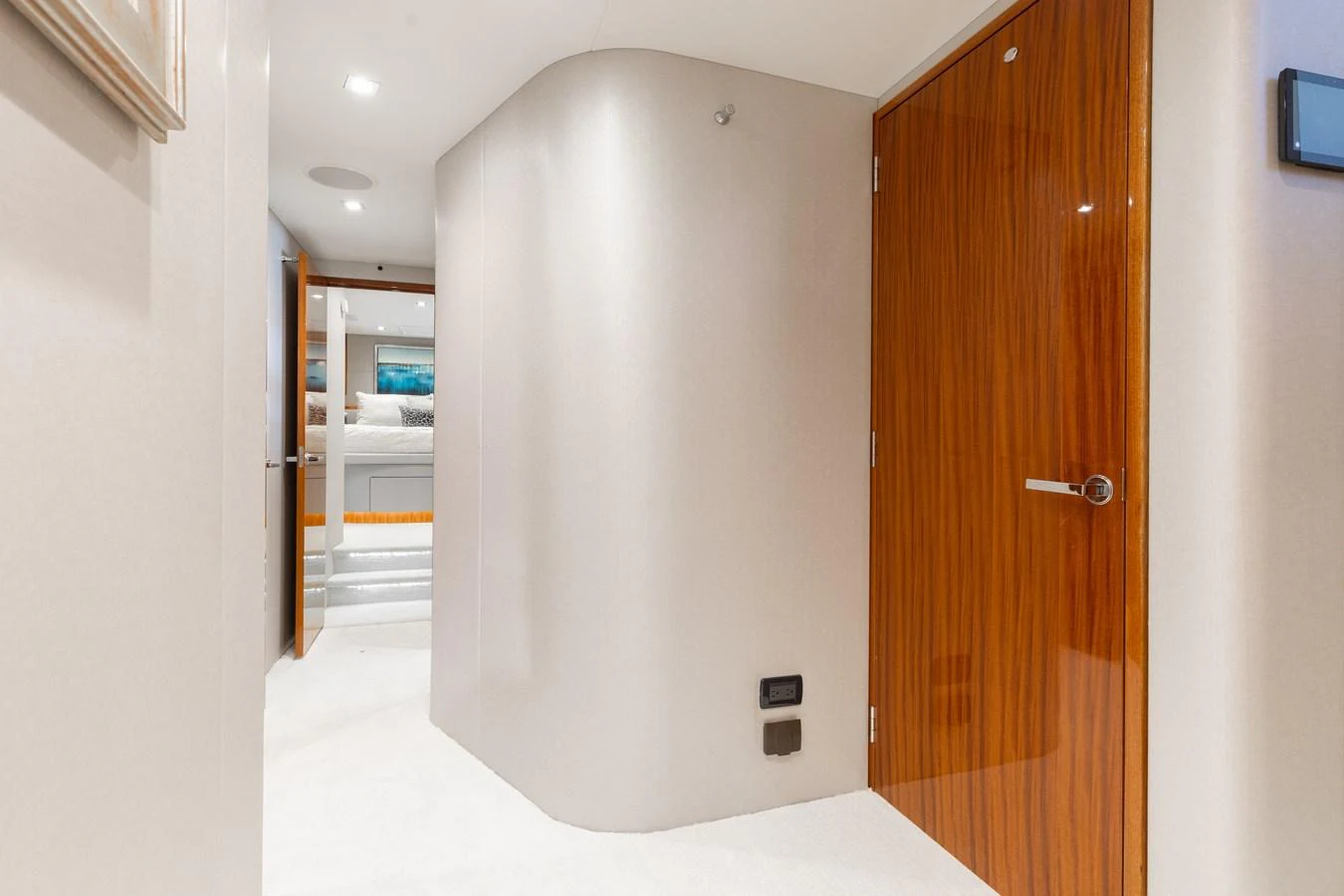A sleek and modern hallway leading to a luxurious stateroom. aboard RITZ SEA Yacht for Sale