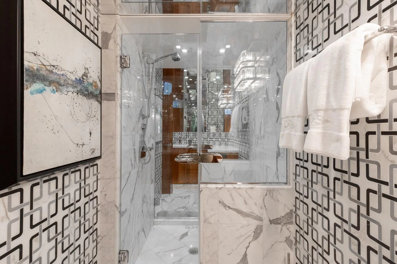 The bathroom features elegant marble surfaces and modern fixtures, creating a luxurious and sophisticated atmosphere. aboard RITZ SEA Yacht for Sale
