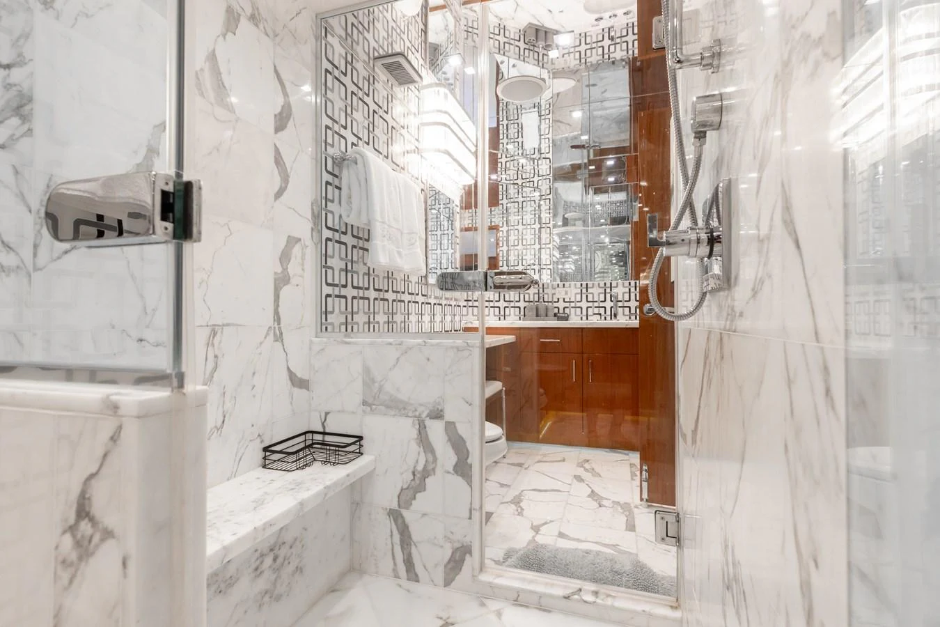 The yacht's bathroom features luxurious marble finishes and modern fixtures. aboard RITZ SEA Yacht for Sale