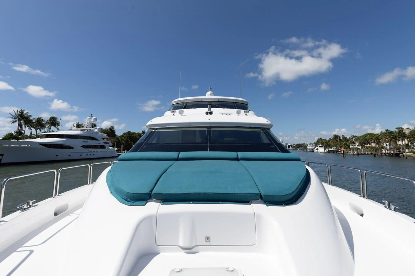 The yacht's bow features a spacious sunpad area under a clear blue sky. aboard RITZ SEA Yacht for Sale