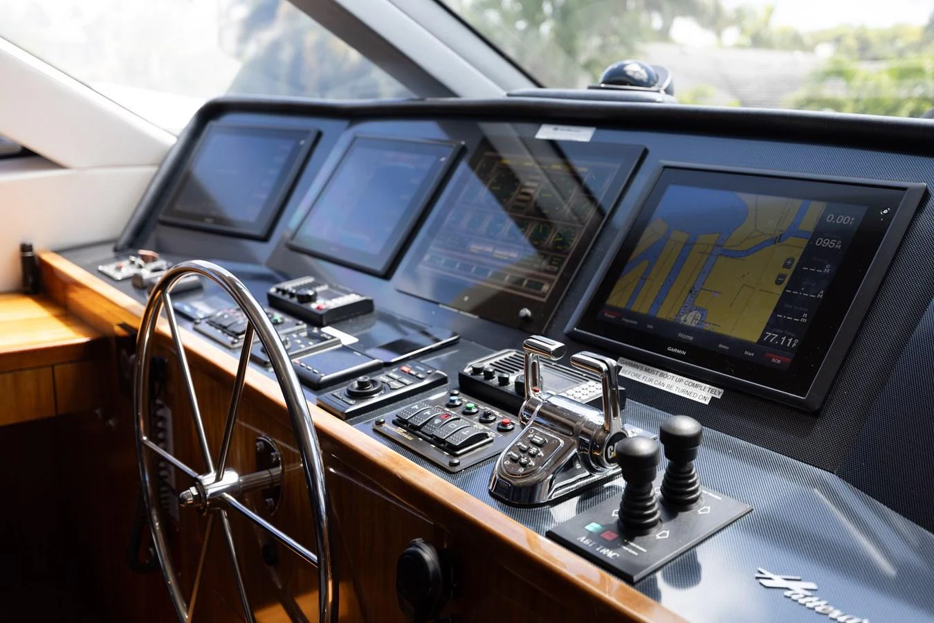 The helm station features advanced navigation equipment and a sleek design. aboard RITZ SEA Yacht for Sale