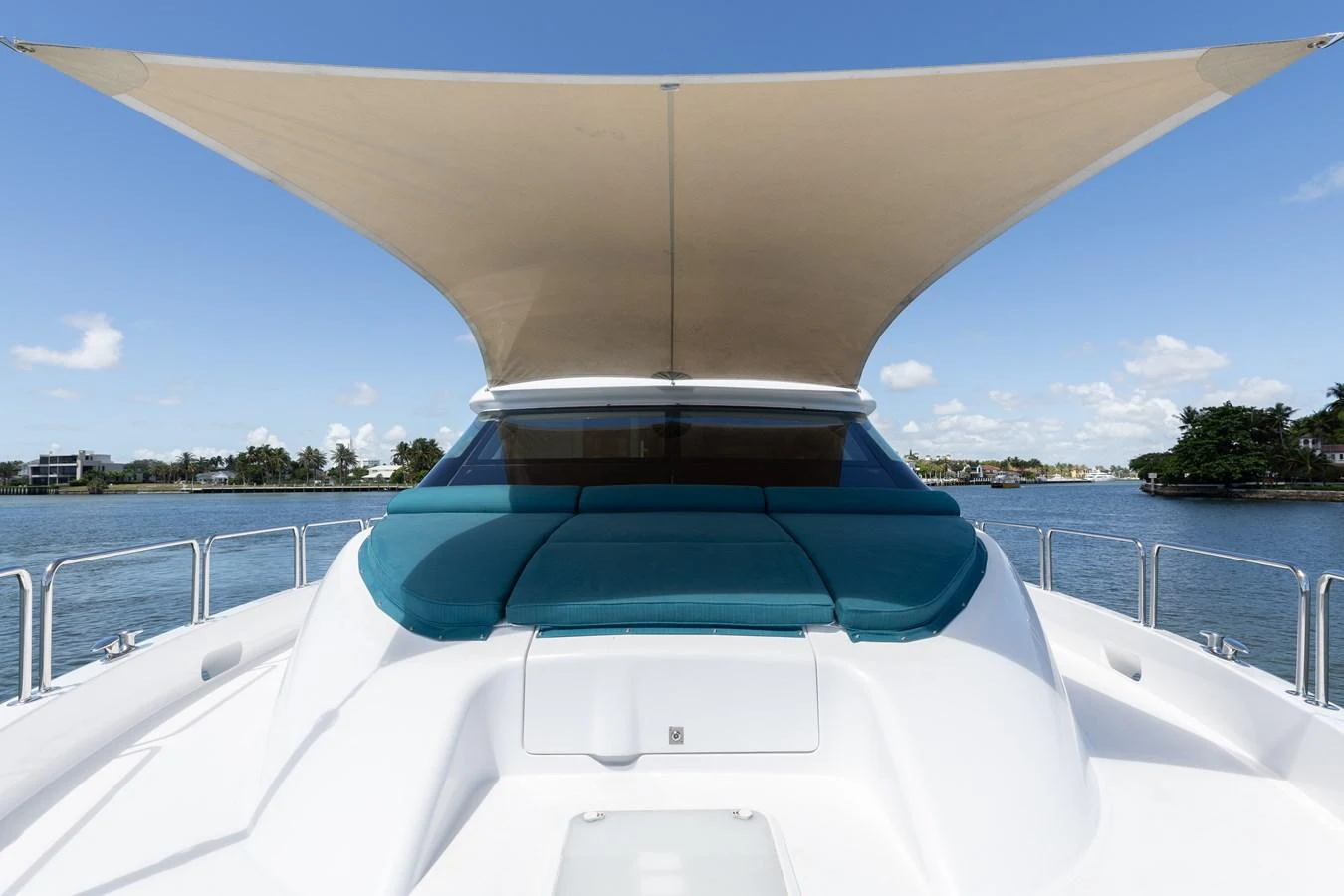 The yacht's bow features a spacious sunbathing area with a stylish sunshade. aboard RITZ SEA Yacht for Sale