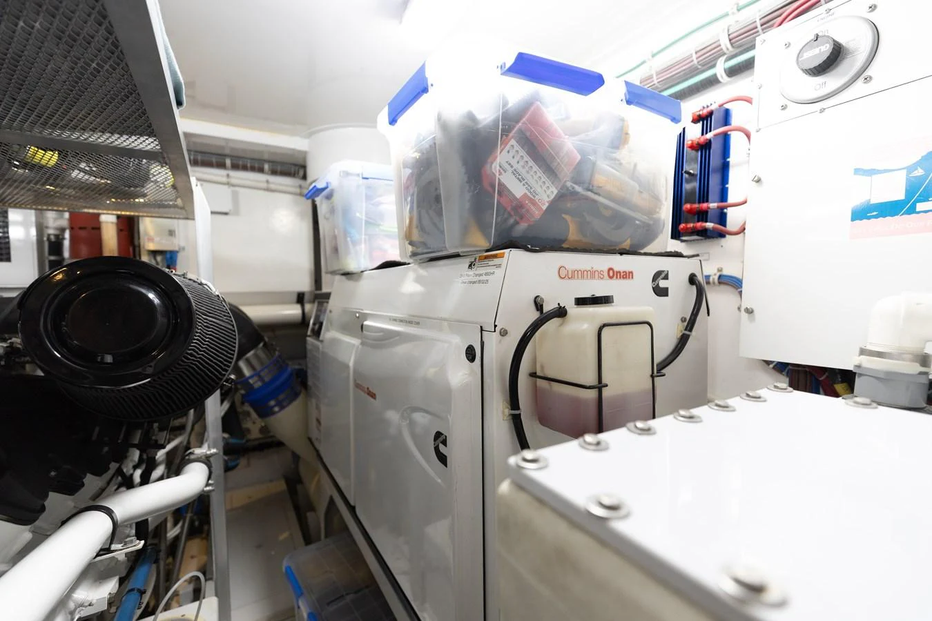 The image showcases the yacht's well-organized engine room with a Cummins Onan generator. aboard RITZ SEA Yacht for Sale