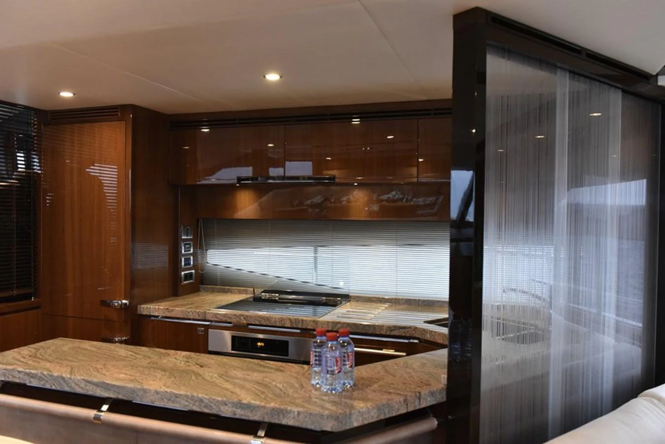 The yacht's galley features modern appliances and elegant finishes, creating a sophisticated culinary space. aboard KAZZA Yacht for Sale
