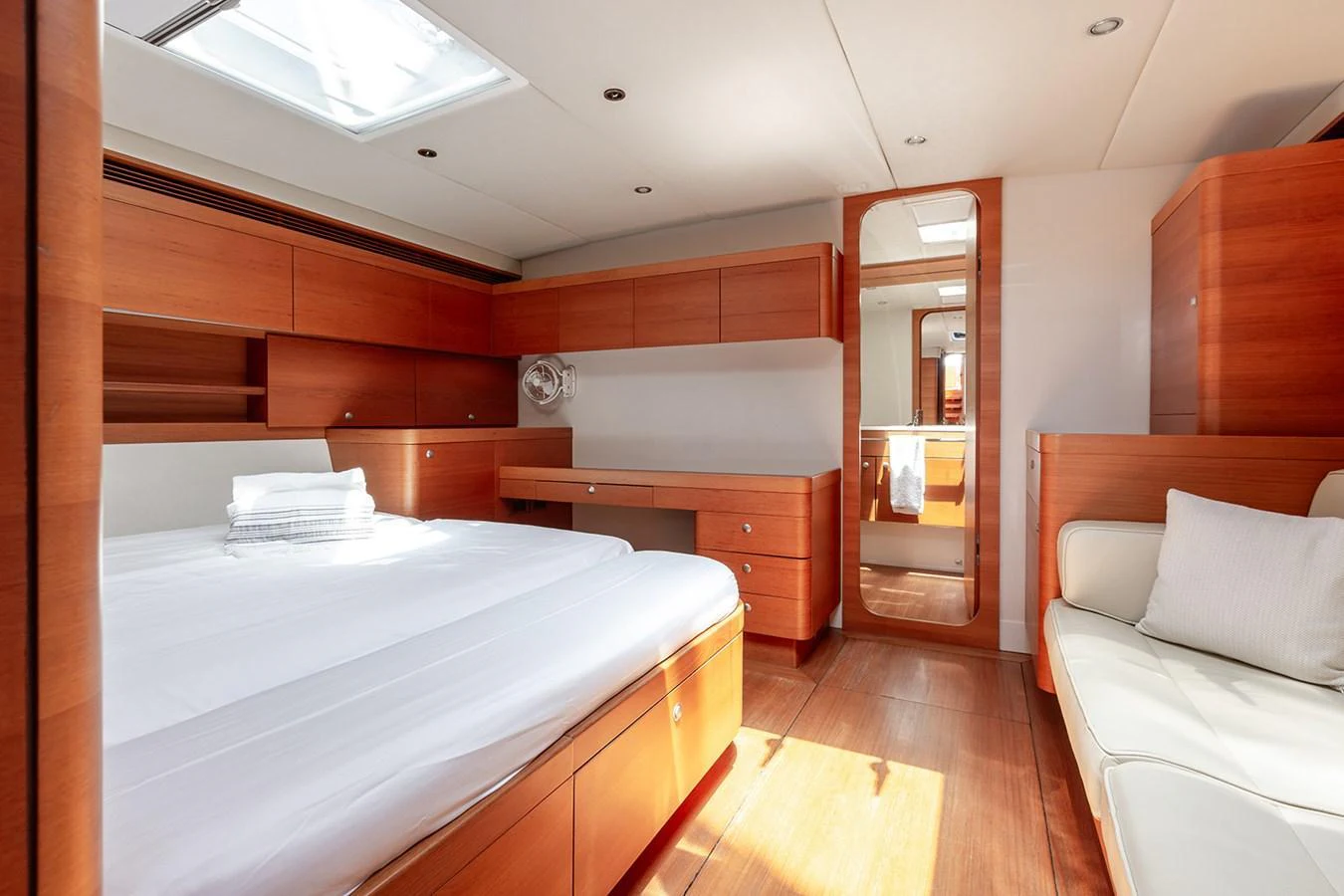 The master stateroom features elegant wood finishes and ample natural light. aboard CAIAROSSA Yacht for Sale