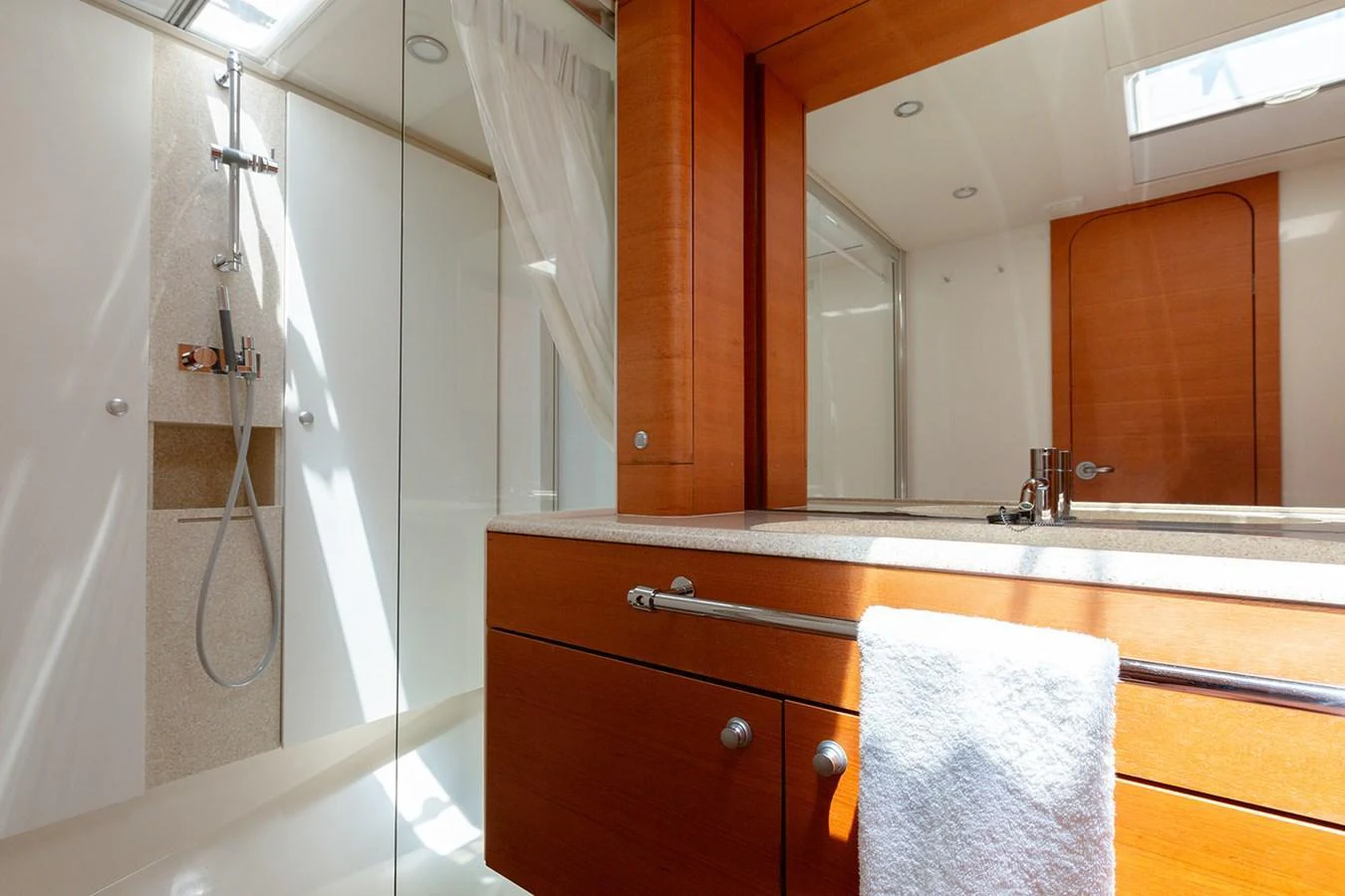 The yacht's bathroom features modern fixtures and ample natural light. aboard CAIAROSSA Yacht for Sale