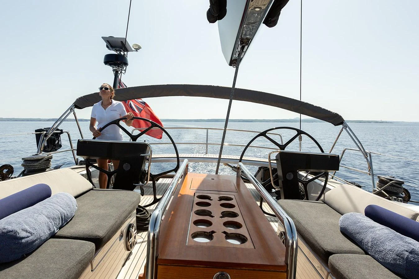 The yacht's cockpit features dual helm stations and comfortable seating, perfect for enjoying the open sea. aboard CAIAROSSA Yacht for Sale