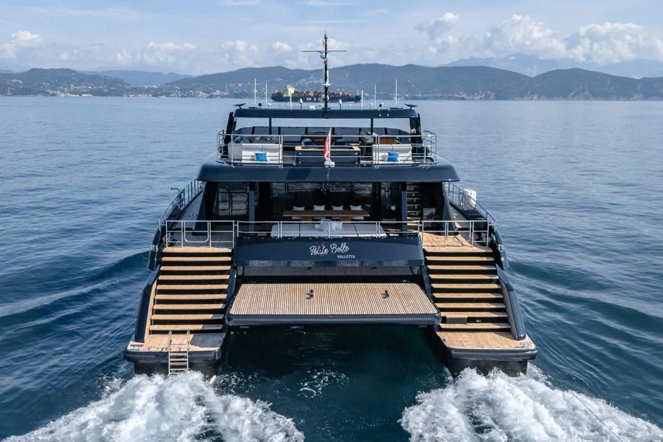 The yacht's expansive aft deck features multiple levels and a spacious swim platform, perfect for enjoying the open sea. aboard PETITE BELLE Yacht for Sale