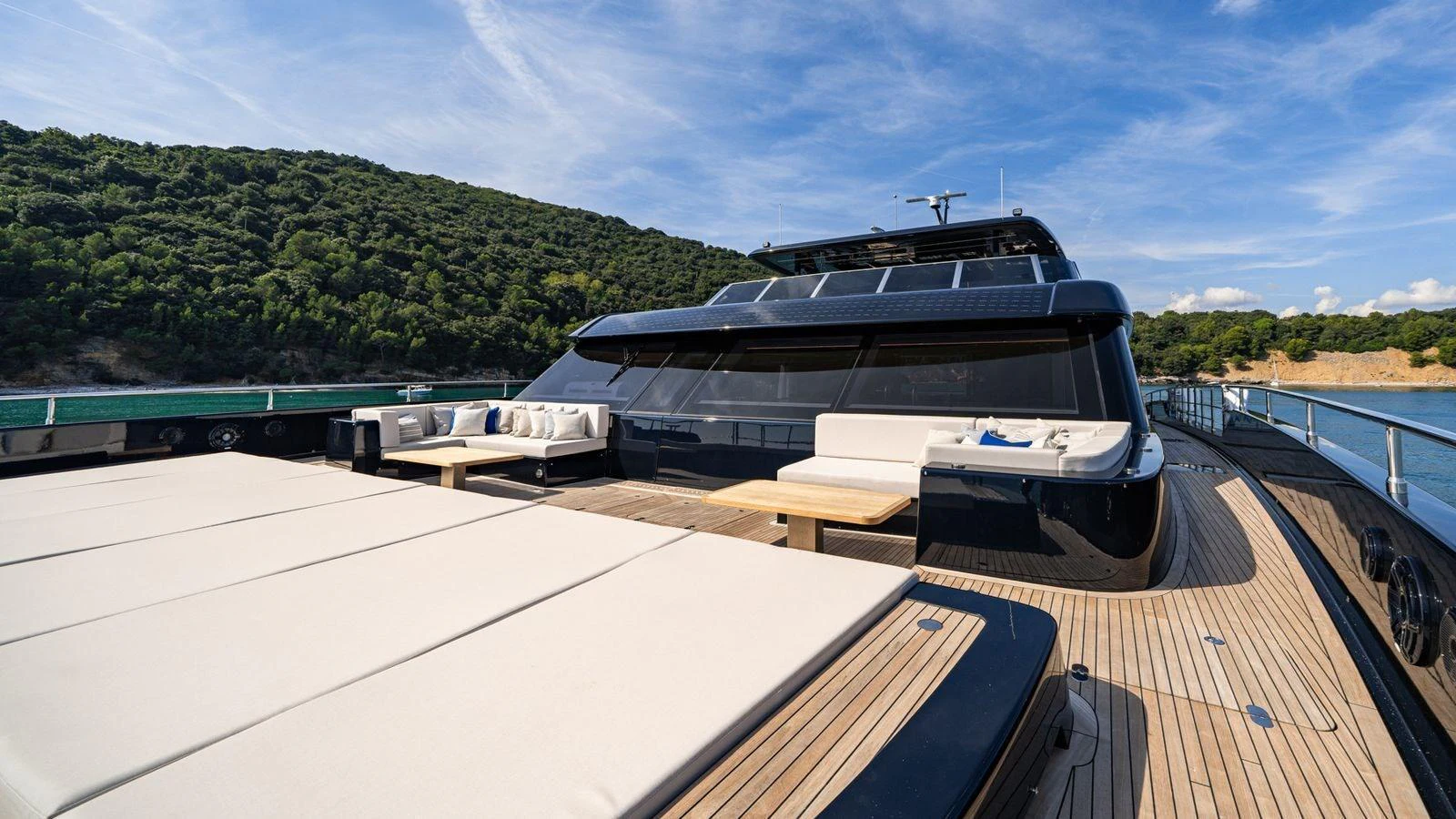 The foredeck of this yacht features spacious sun pads and comfortable seating areas, perfect for relaxation. aboard PETITE BELLE Yacht for Sale