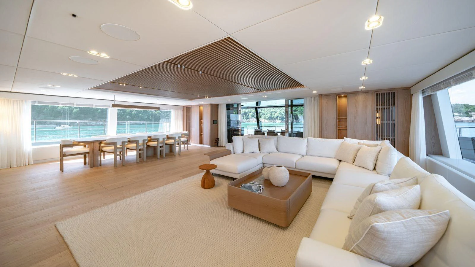 The spacious salon features elegant furnishings and ample natural light. aboard PETITE BELLE Yacht for Sale