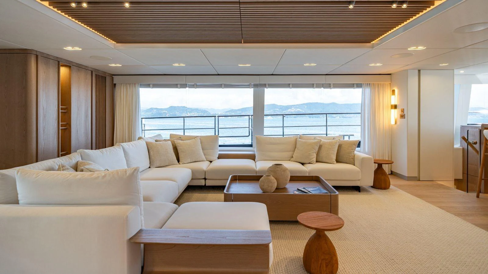 The spacious salon features elegant seating with panoramic views of the sea. aboard PETITE BELLE Yacht for Sale