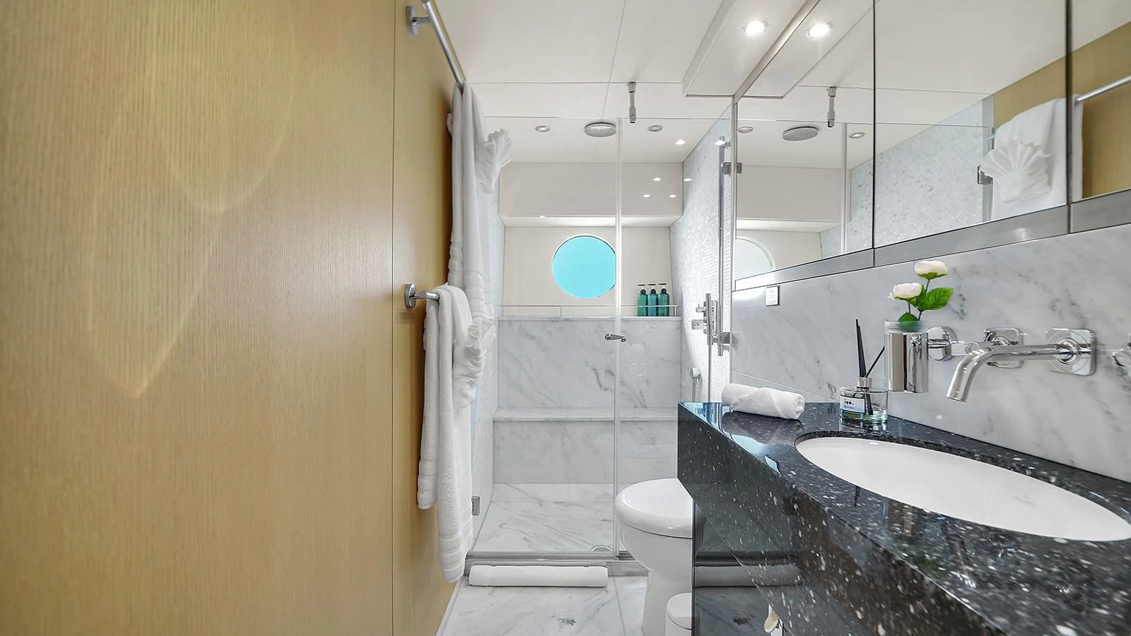 a bathroom with a marble countertop aboard M4 Yacht for Sale