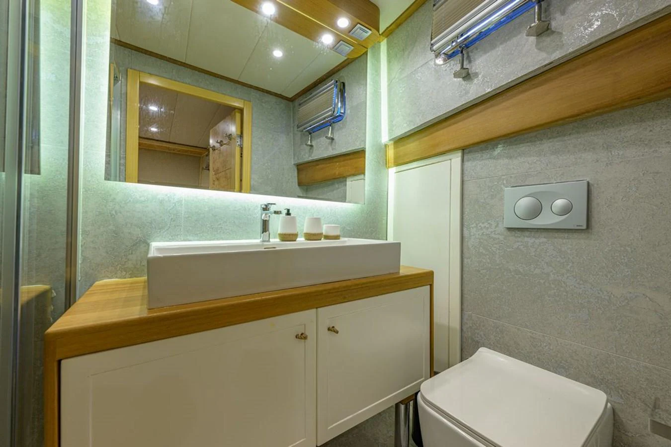 The yacht's bathroom features modern fixtures and a clean, elegant design. aboard BELGIN SULTAN Yacht for Sale