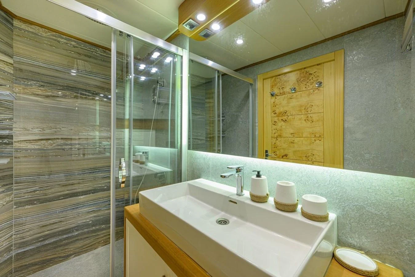 The yacht's bathroom features a modern design with a spacious shower and elegant fixtures. aboard BELGIN SULTAN Yacht for Sale