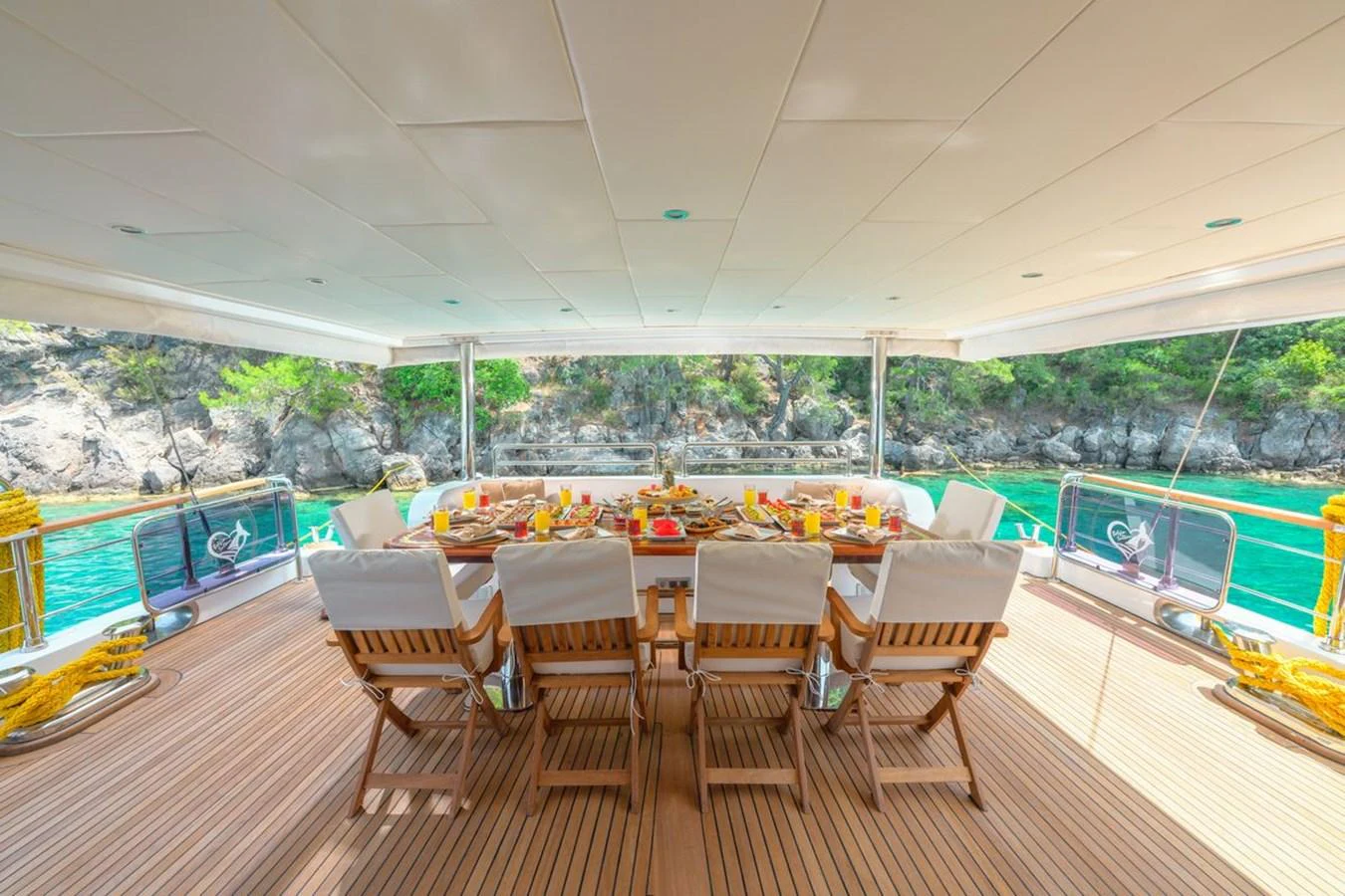 The aft deck features an elegant dining area with a stunning view of the surrounding waters. aboard BELGIN SULTAN Yacht for Sale