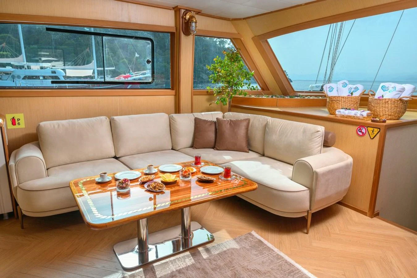 The salon features a comfortable seating area with a large window offering scenic views. aboard BELGIN SULTAN Yacht for Sale