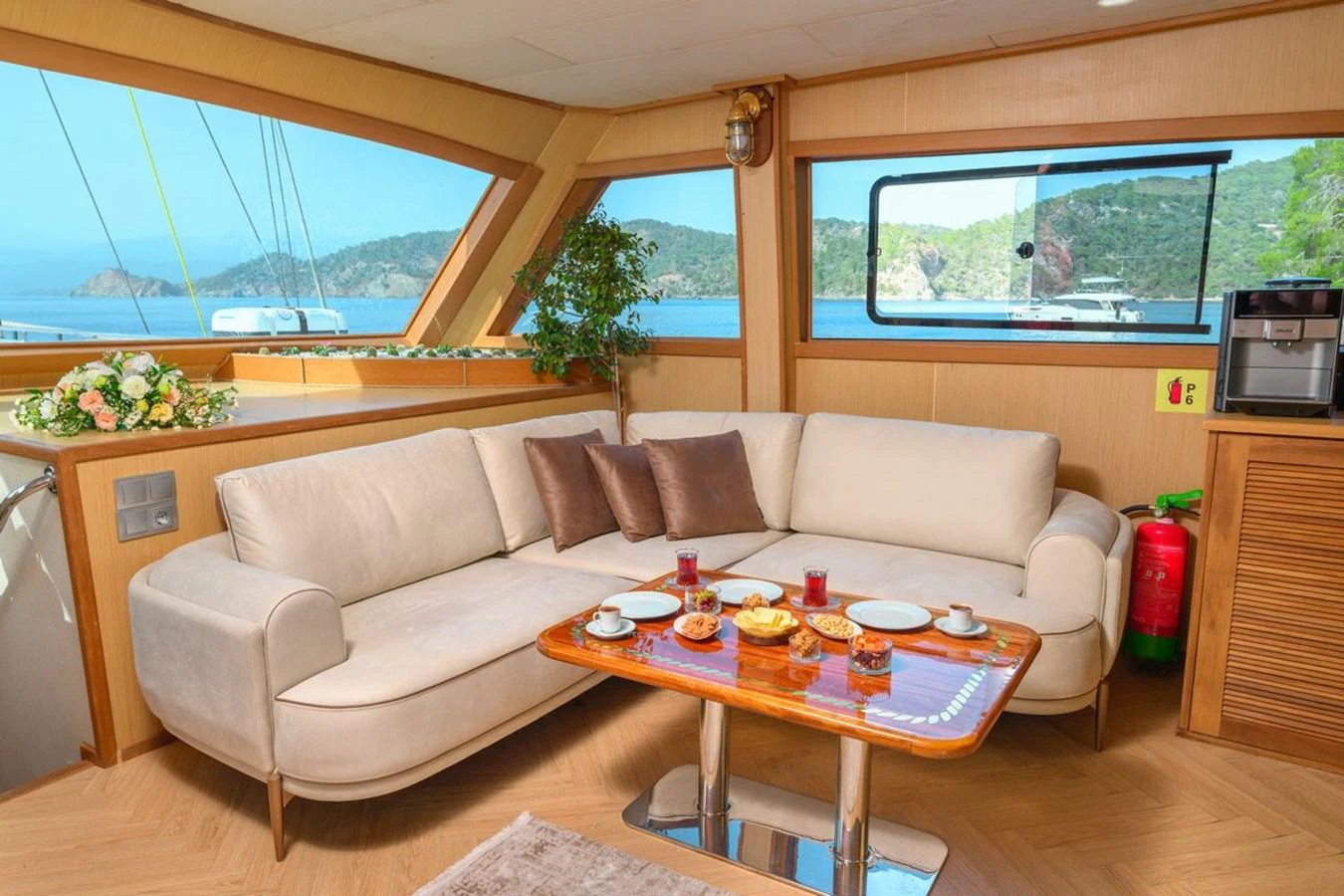 The salon features a comfortable seating area with panoramic windows offering stunning views. aboard BELGIN SULTAN Yacht for Sale
