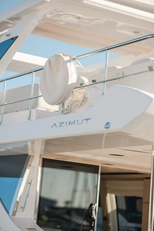 A close-up view of the yacht's upper deck showcasing sleek design and branding. aboard HELSIE SI Yacht for Sale