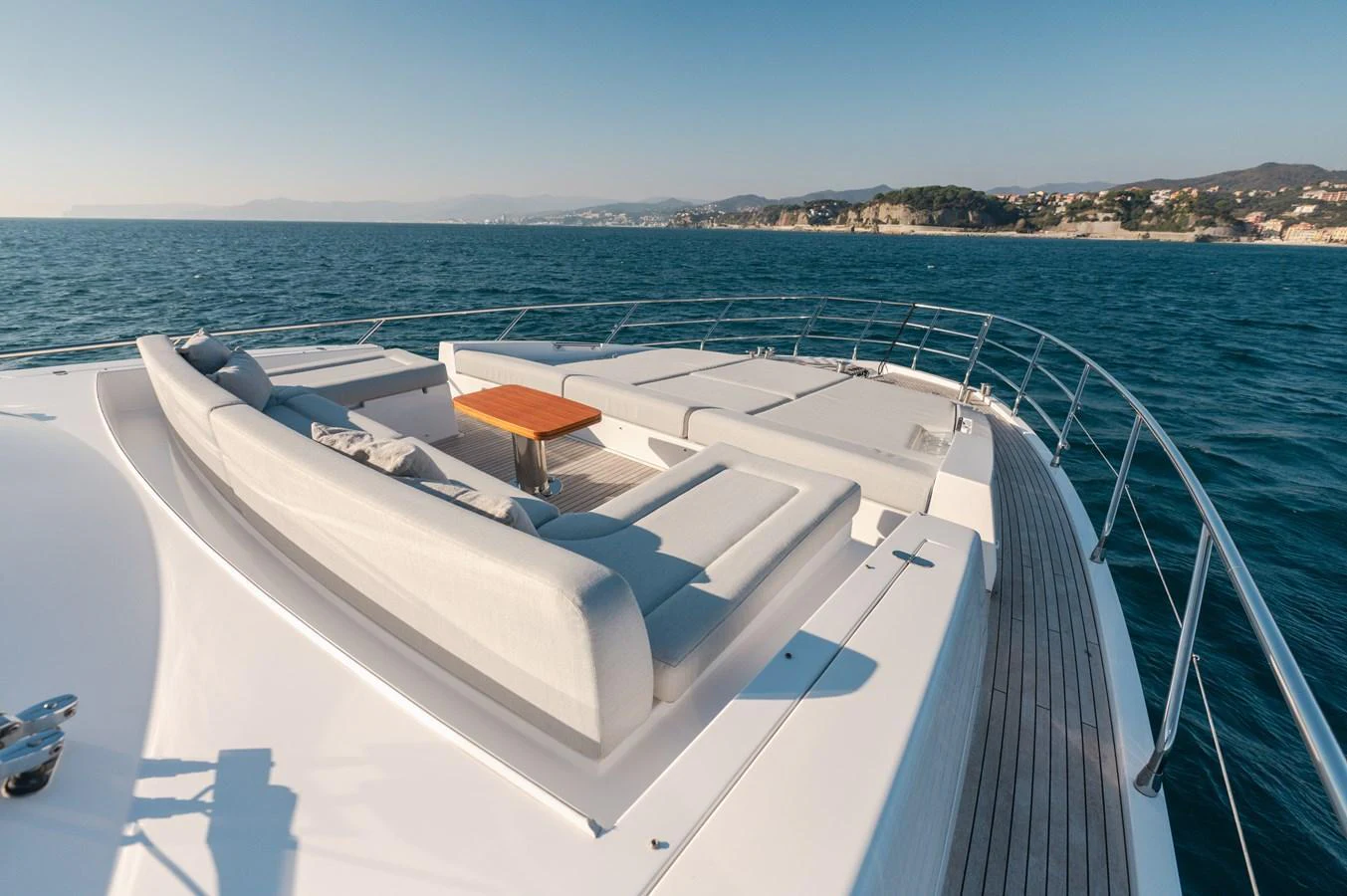 The foredeck features a spacious sunbathing area with plush seating and a central table, perfect for relaxation and enjoying the sea view. aboard HELSIE SI Yacht for Sale