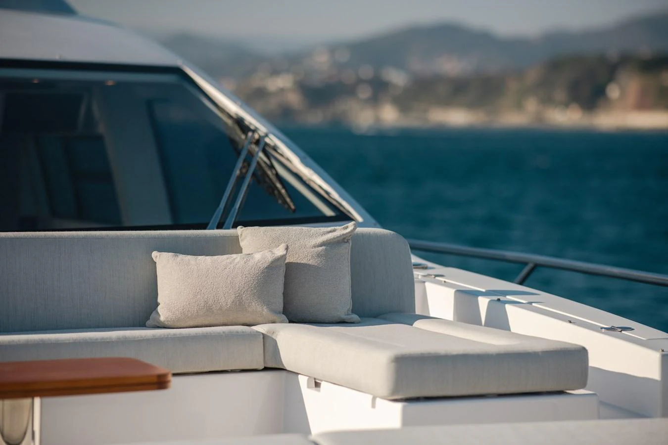 The aft deck features a comfortable seating area with plush cushions, perfect for relaxation while enjoying the sea views. aboard HELSIE SI Yacht for Sale