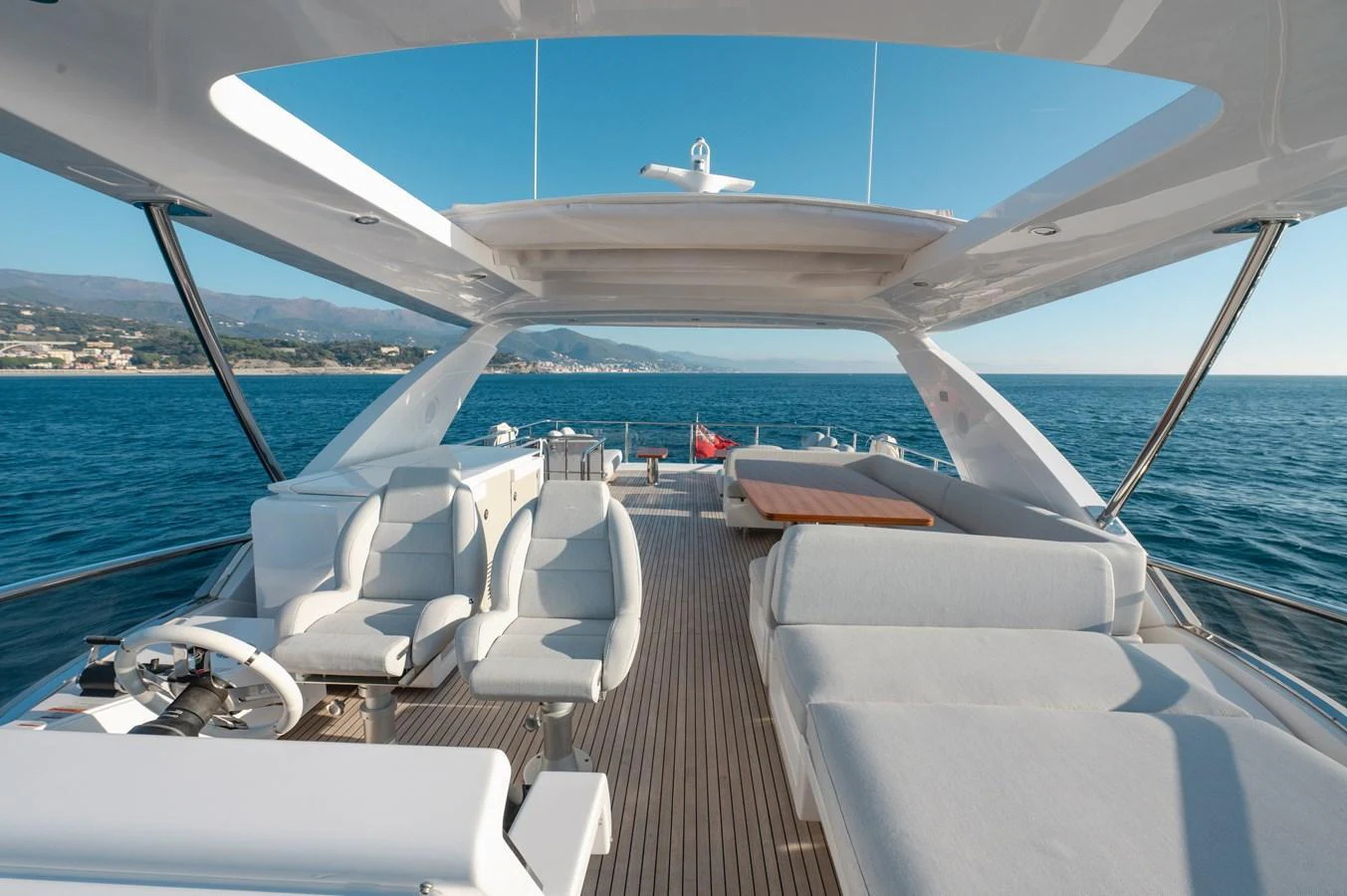 The flybridge offers a spacious and luxurious outdoor area with comfortable seating and stunning views of the sea. aboard HELSIE SI Yacht for Sale