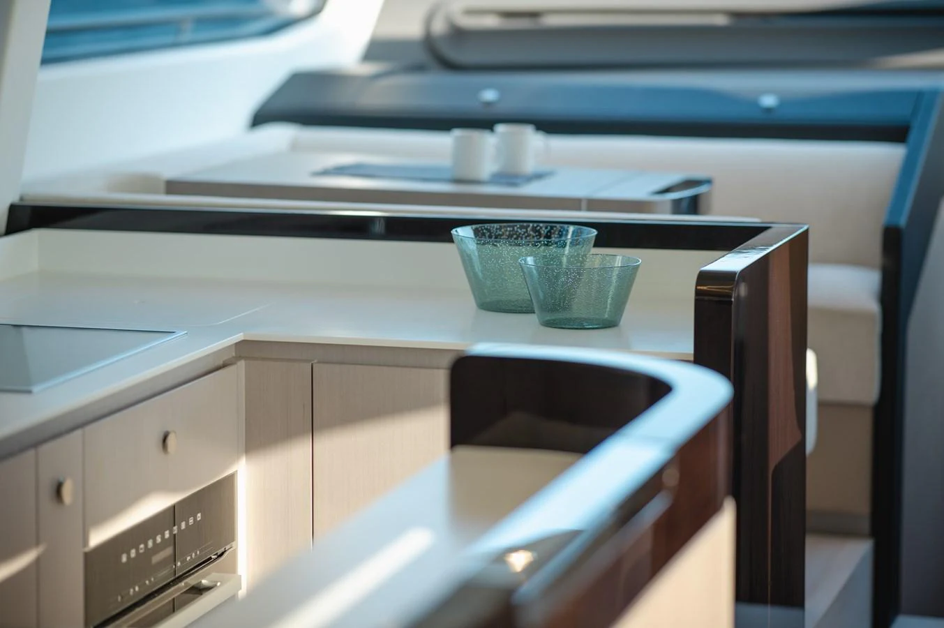 The modern galley features sleek cabinetry and stylish glassware, creating a sophisticated culinary space. aboard HELSIE SI Yacht for Sale