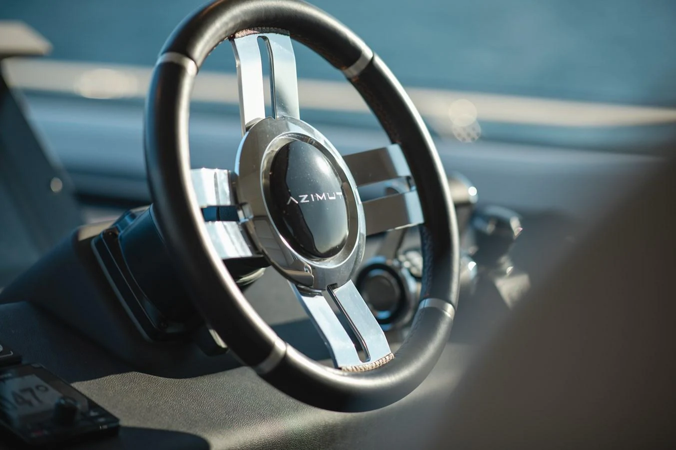 A close-up view of the yacht's steering wheel, showcasing its sleek design and craftsmanship. aboard HELSIE SI Yacht for Sale