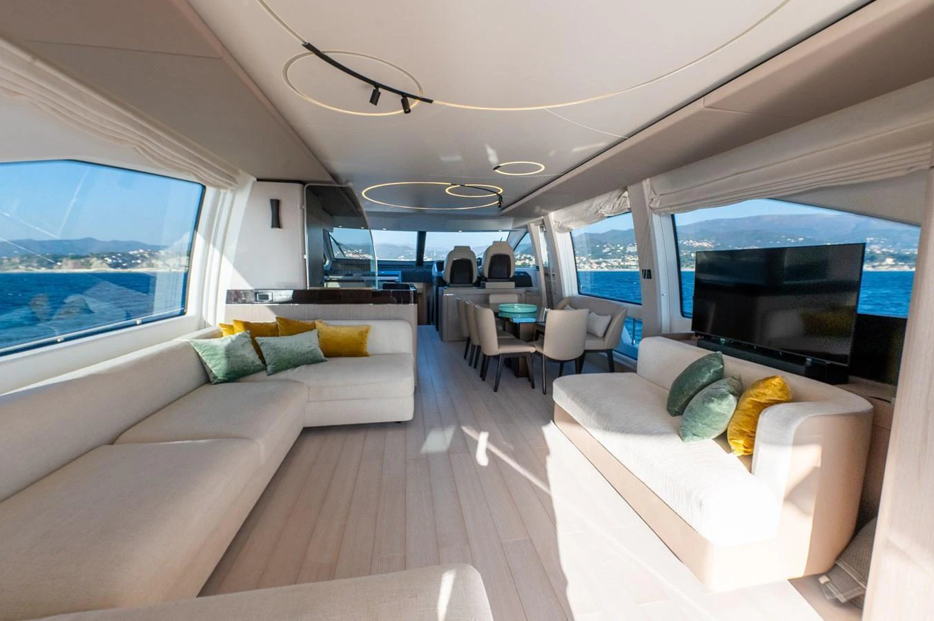 The spacious salon features elegant seating with panoramic views of the sea. aboard HELSIE SI Yacht for Sale