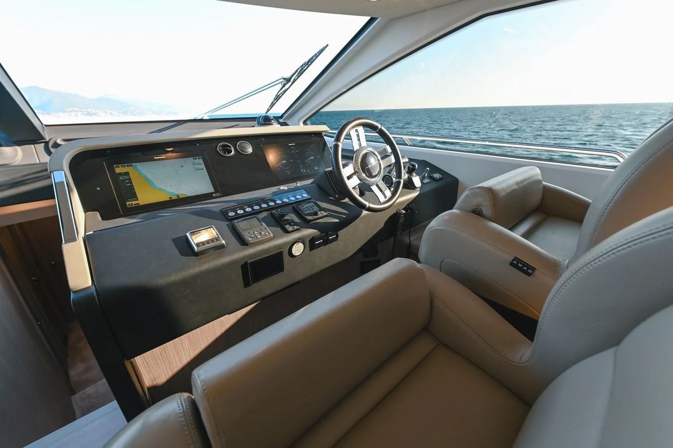 The helm station offers a sophisticated and comfortable command center with a panoramic view of the sea. aboard HELSIE SI Yacht for Sale