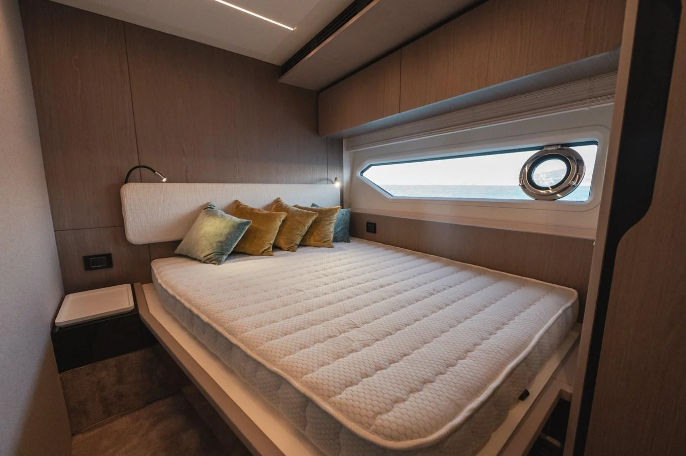 The stateroom features a comfortable bed with plush pillows and a modern, sleek design. aboard HELSIE SI Yacht for Sale