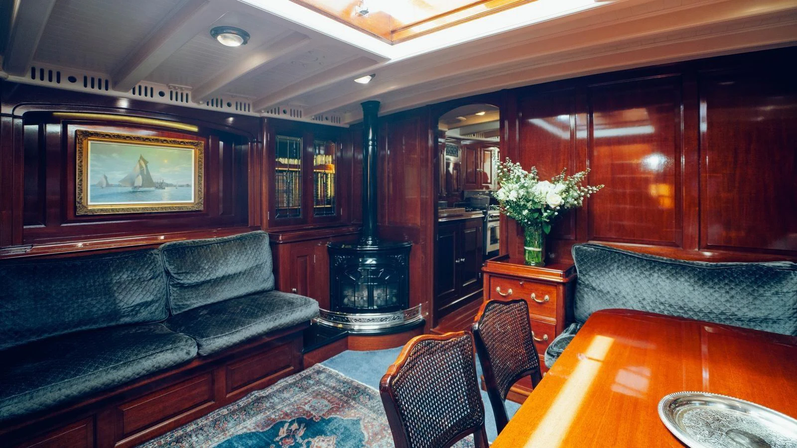a living room with a leather couch aboard SAVANNAH Yacht for Sale