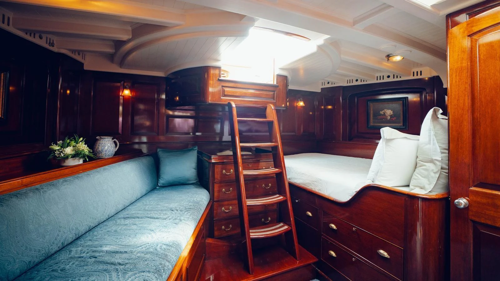 a room with a bed and a couch aboard SAVANNAH Yacht for Sale