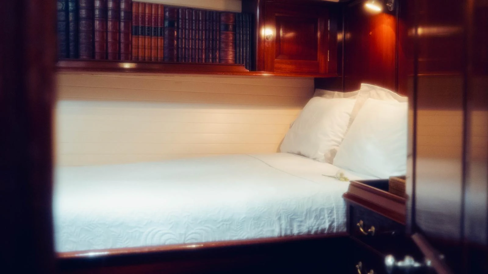 a bed with white sheets aboard SAVANNAH Yacht for Sale