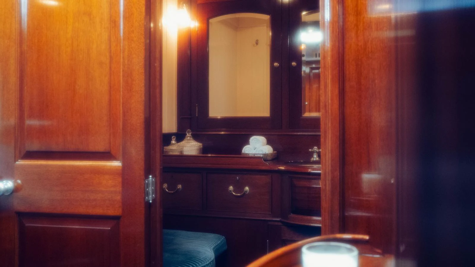 a bathroom with a wood cabinet aboard SAVANNAH Yacht for Sale