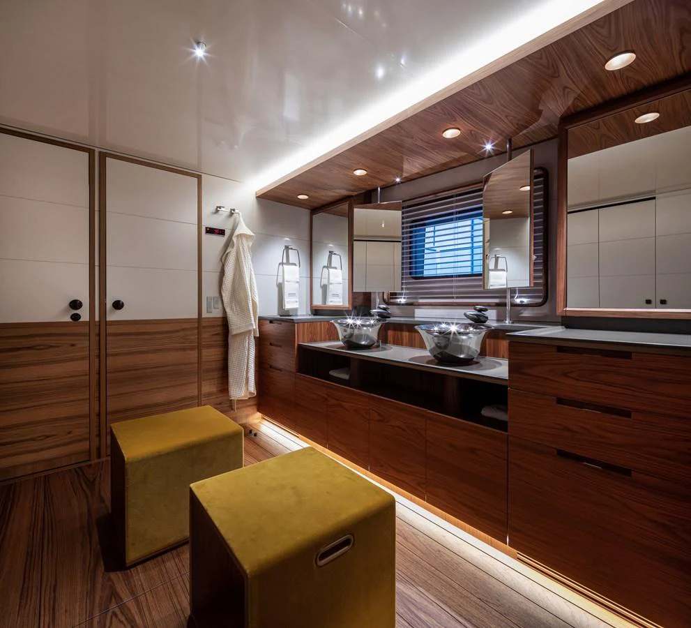 This luxurious yacht bathroom features elegant wood finishes and modern fixtures. aboard CANOVA Yacht for Sale
