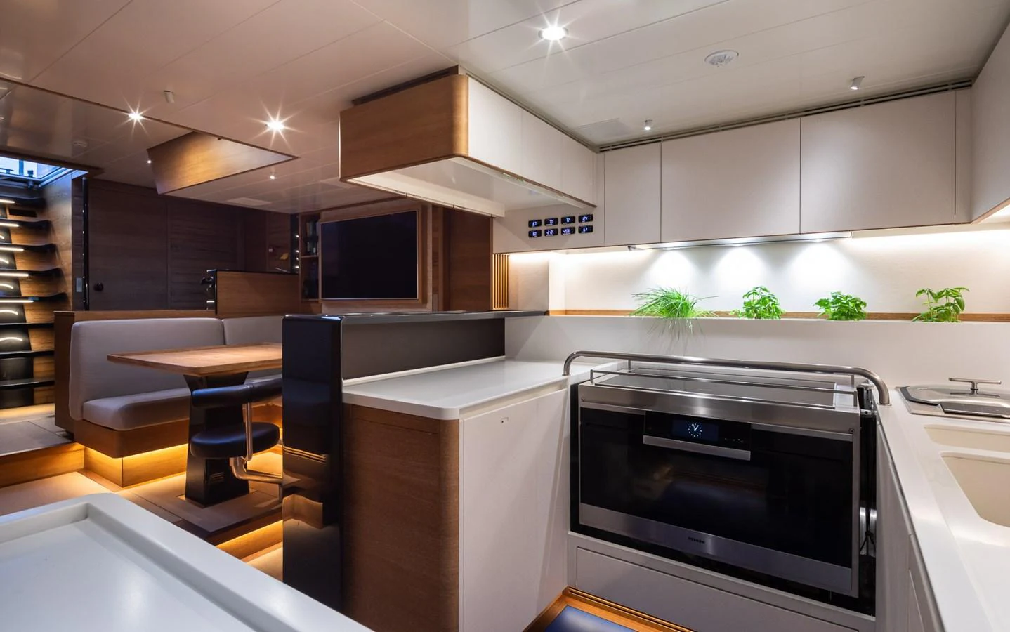 The yacht's galley features modern appliances and a sleek design, perfect for gourmet cooking. aboard CANOVA Yacht for Sale