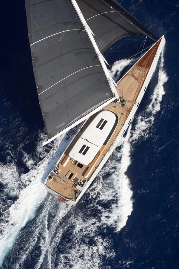 A sleek sailing yacht glides gracefully through the deep blue sea, showcasing its elegant design and powerful sails. aboard CANOVA Yacht for Sale
