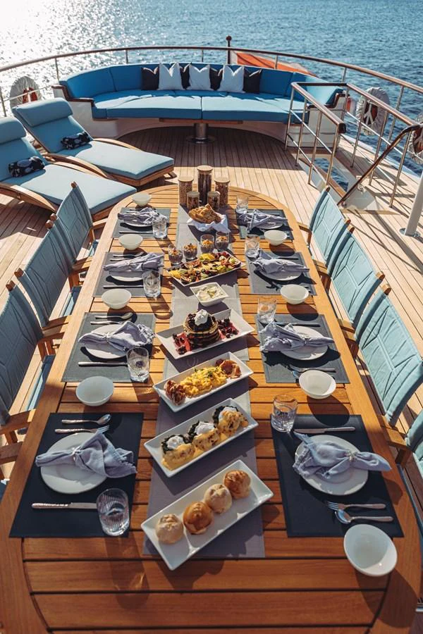 a table with food on it aboard FAR NIENTE Yacht for Sale