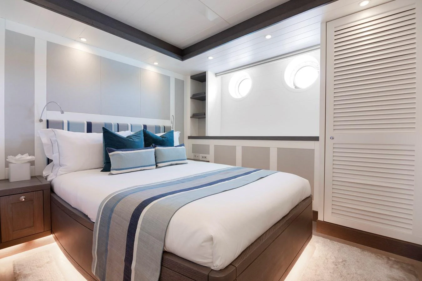 a bedroom with a bed and a desk aboard FAR NIENTE Yacht for Sale