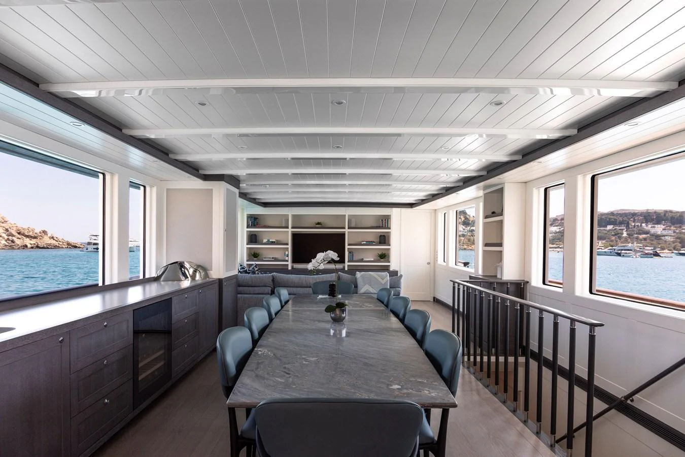 a large room with a table and chairs aboard FAR NIENTE Yacht for Sale
